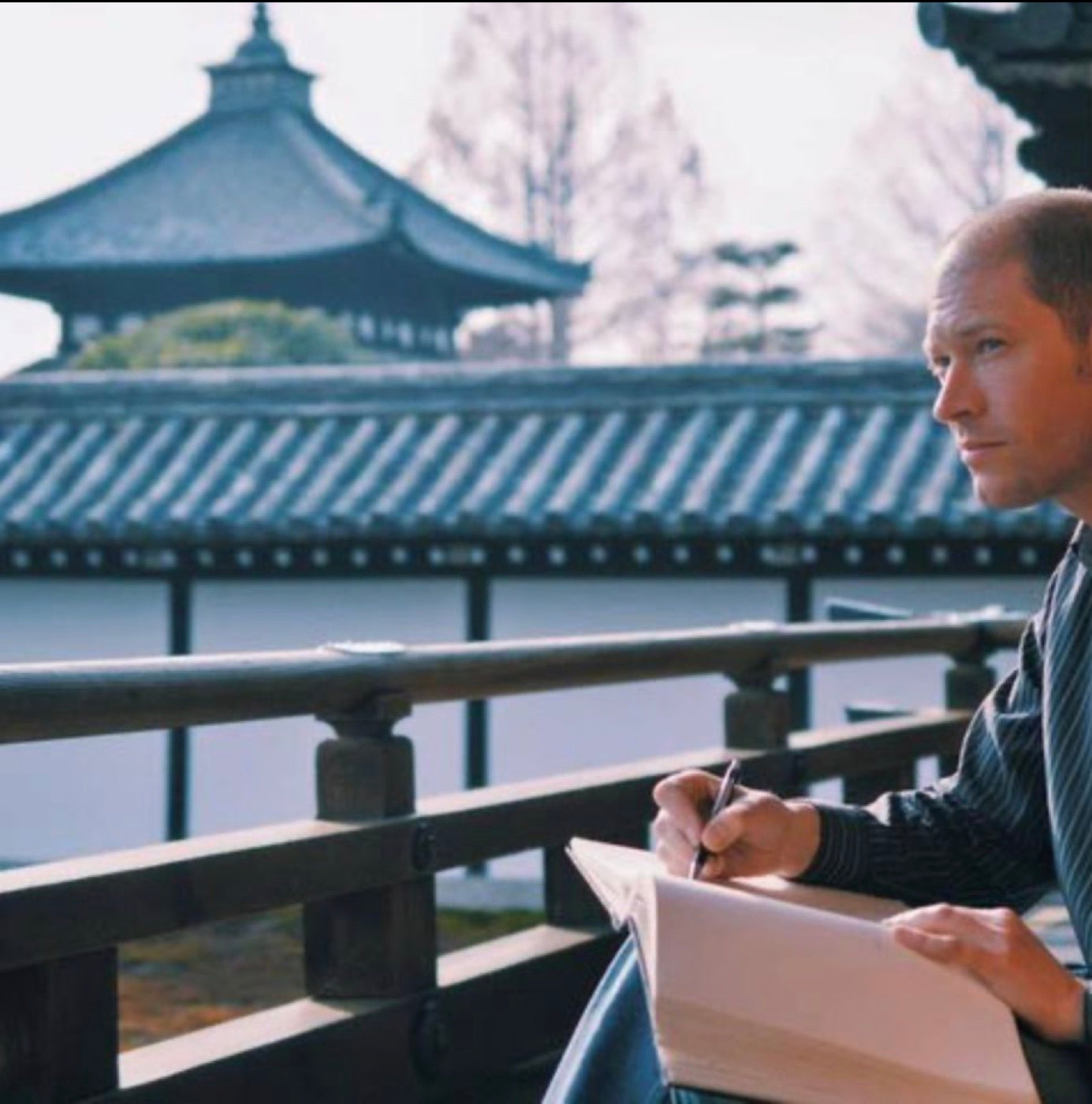 Artist Aaron Trotter drawing outdoors while visiting a place